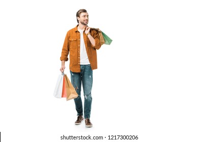 Happy Man Walking With Colorful Shopping Bags Isolated On White