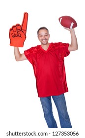 Happy Man Wearing Foam Finger And Holding Rugby Ball On White Background