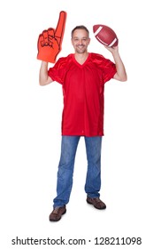 Happy Man Wearing Foam Finger And Holding Rugby Ball On White Background