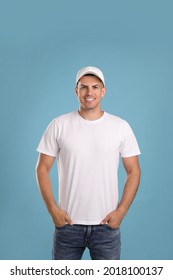 Happy Man In White Cap And Tshirt On Light Blue Background. Mockup For Design