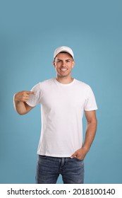 Happy Man In White Cap And Tshirt On Light Blue Background. Mockup For Design