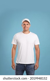 Happy Man In White Cap And Tshirt On Light Blue Background. Mockup For Design