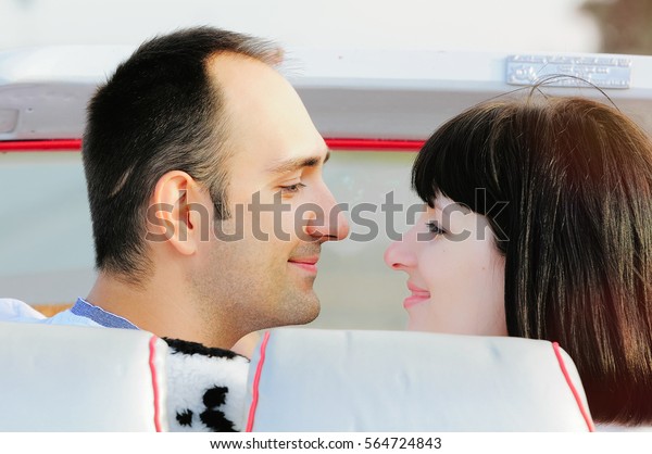 happy man and woman in
car front view