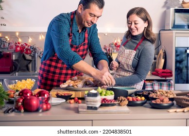 Happy Man And Woman Cooking Together Traditional Dinner For Christmas At Home Kitchen