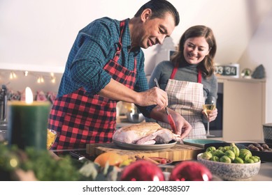 Happy Man And Woman Cooking Together Traditional Dinner For Christmas At Home Kitchen