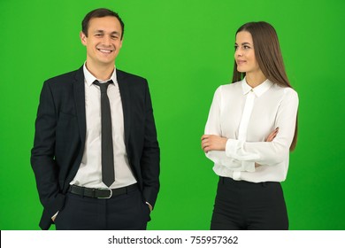The happy man and woman stand on the green background - Powered by Shutterstock