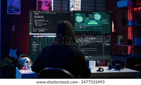Happy man writing code on PC, celebrating after managing to get past security systems. Hacker using computer to make scripts that can hack devices, feeling proud after breaching firewall, camera A