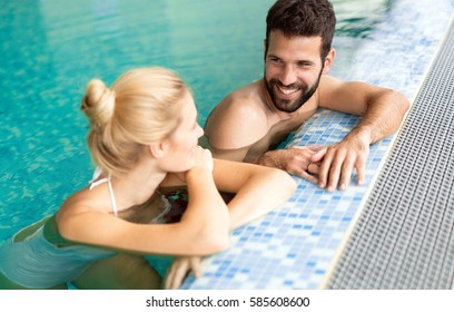 Happy married couple relaxing at wellness spa resort