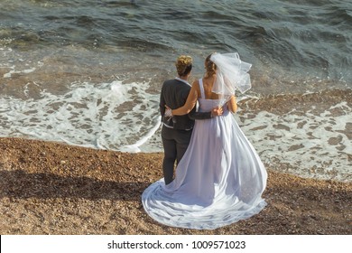 Happy Married Lesbian Couple Enjoying The Moment On Their LGBTQ Wedding On A Sunny Day On The Beach In The Provence In France