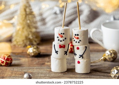 Happy marshmallow snowmen and Christmas winter holiday decorations. - Powered by Shutterstock