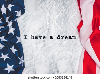 Happy Martin Luther King Day. Congratulatory Inscription On The Background Of The American Flag. No People. Closeup, Top View. Congratulations For Family, Relatives, Friends And Colleagues