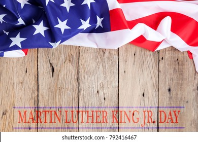 Happy Martin Luther King Jr. Day Background With American Flags On Old Wood Background