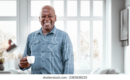 Happy Mature Black Man Drinking Coffee while relaxing at home. Retirement Lifestyle And Leisure Concept - Powered by Shutterstock