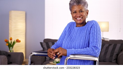 Happy Mature black woman sitting in wheelchair