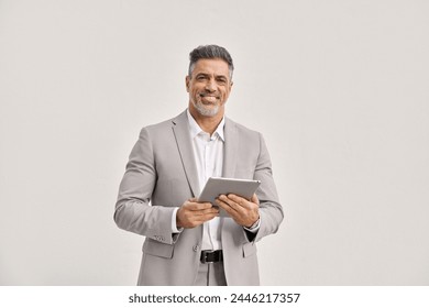 Happy mature business man using digital tablet isolated on white background. Middle aged ceo executive wearing suit, older businessman male professional entrepreneur looking at camera, portrait. - Powered by Shutterstock