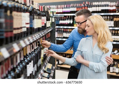 Happy Mature Couple Buying Wine At The Supermarket Copyspace Variety Choice Family Couple Husband Wife Shopping Choosing Consumerism Lifestyle Winery Store Shop Customers Event Celebration Concept