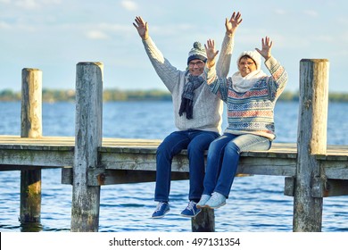 Happy Mature Couple Enjoy Their Life At Lake, Winter At Lake