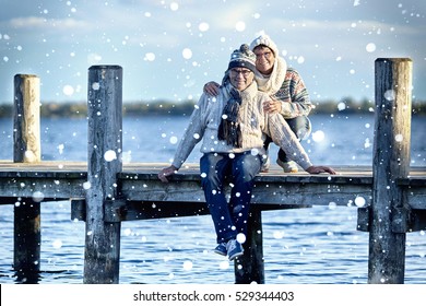 Happy Mature Couple Enjoy Their Life At Lake, Winter At Lake                               