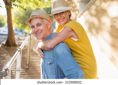 Happy Mature Couple Having Fun In The City On A Sunny Day