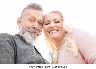 Happy Mature Couple On White Background