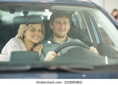 Happy Mature Couple Smiling Joyfully Cuddling In Their Car While Driving Travelling Tourism Ownership Safety Insurance Security Ownership Relationships People Marriage Love Lifestyle Transportation