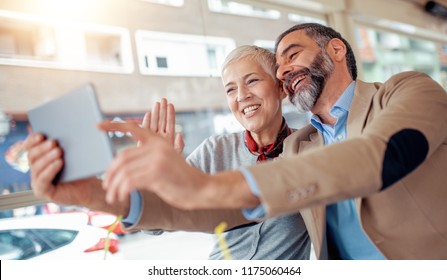 Happy mature couple take selfie at cafe. - Powered by Shutterstock