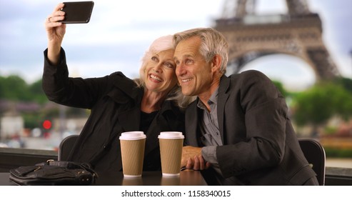 Happy Mature Couple Taking A Selfie In Paris