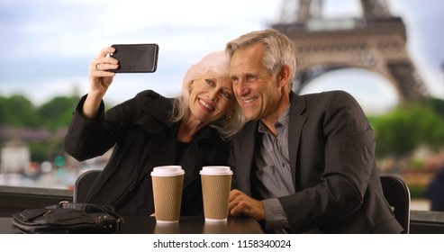 Happy Mature Couple Taking A Selfie In Paris