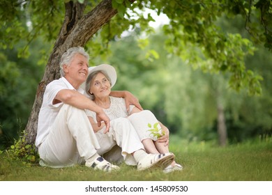 happy Mature couple walks in the park in summer day - Powered by Shutterstock