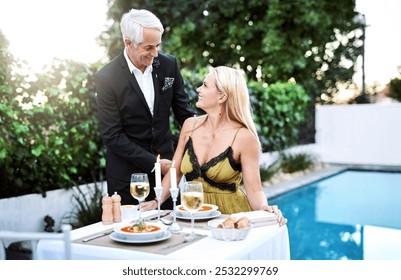 Happy, mature couple and wine glasses in cafe, outdoor or relax for celebration in restaurant. Woman, man and anniversary with cheerful on date, vacation or holiday for calm, peace and love in France - Powered by Shutterstock