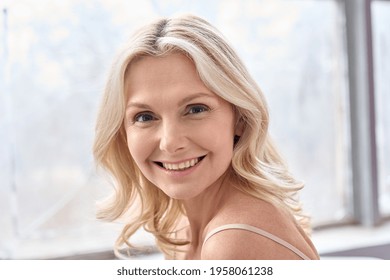 Happy Mature Elder 50s Woman Indoors. Closeup Headshot Portrait Of Attractive Mid Age Woman Looking Smiling At Camera. Beauty, Skin Care