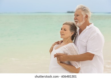 Happy mature male female Caucasian couple living a healthy outdoor leisure lifestyle on a Caribbean beach - Shutterstock ID 606481301