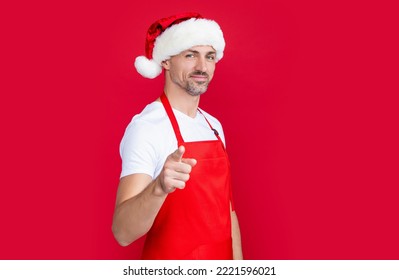 Happy Mature Man Shop Owner In Red Apron And Christmas Santa Hat