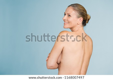 Happy mature naked woman standing showing her back isolated over grey background. Back view of Happy Mature Naked Woman Standing Showing Stockfoto (Jetzt ...