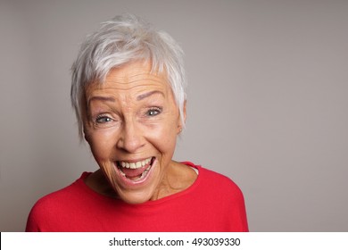 Happy Mature Senior Woman With Short White Hair Laughing