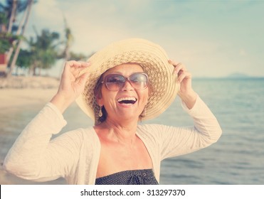 Happy Mature Woman Of 50 Years On The Beach