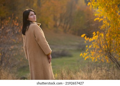 Happy Mature Woman In Autumn Park
