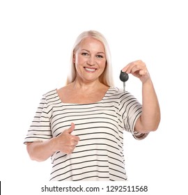 Happy Mature Woman With Car Key On White Background. Getting Driving License