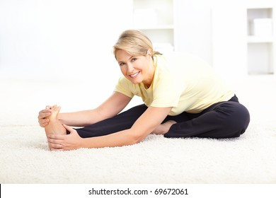 Happy Mature Woman Doing Yoga