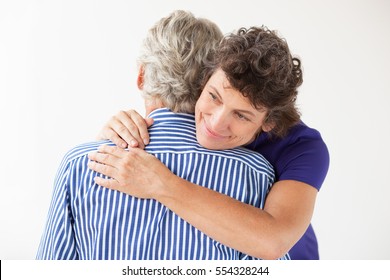 Happy mature woman and man hugging