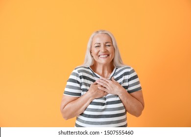 Happy Mature Woman On Color Background