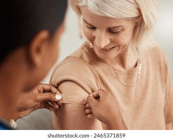 Happy, mature woman and plaster for vaccine or flu injection from nurse in clinic for health and wellness. Senior, female person and smile with bandage for medicine, healthcare and illness protection - Powered by Shutterstock