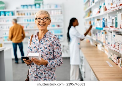 Happy Mature Woman Shopping Vitamins In Drugstore And Looking At Camera.