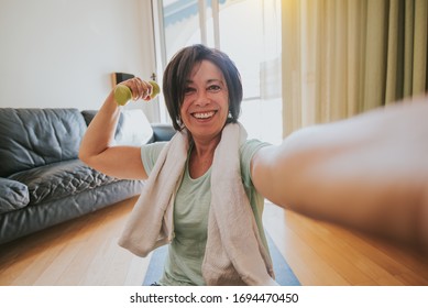 Happy Mature Woman Taking A Selfie At Workout Gym At Home During Quarantine. Concept About People, Gym At Home, Sport.