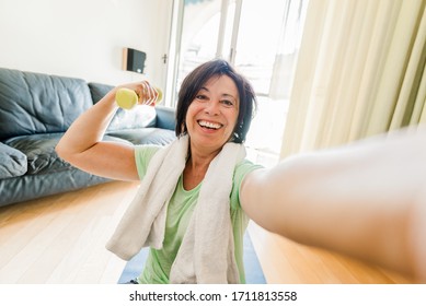 Happy Mature Woman Taking A Selfie At Workout Gym At Home During Quarantine. Concept About People, Gym At Home, Sport.