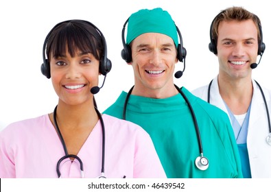Happy medical team using headsets against a white background