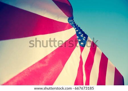 Happy Memorial Day Greeting, USA patriotic flag on blue sky and sunlight background with text Happy Memorial Day.