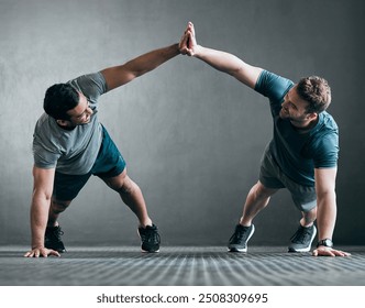 Happy men, high five and fitness with push ups for exercise, workout or training together at gym. Active male person or friends touching hands in success for muscle gain, winning or teamwork on floor - Powered by Shutterstock