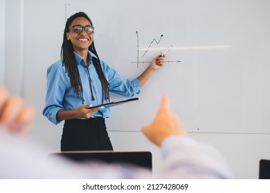 Happy Mentor In Optical Eyewear Have Seminar Presentation In Board Room Training About Trade Exchange, Half Length Portrait Of Cheerful Female Employee Talking About Diagram Statistics And Smiling