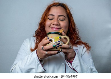 Happy Mexican Woman, Drinking A Cup Of Coffee. Latin Cook